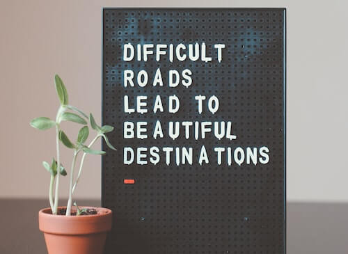 Difficult roads lead to beautiful destinations sign
