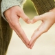 partners hands making a heart shape