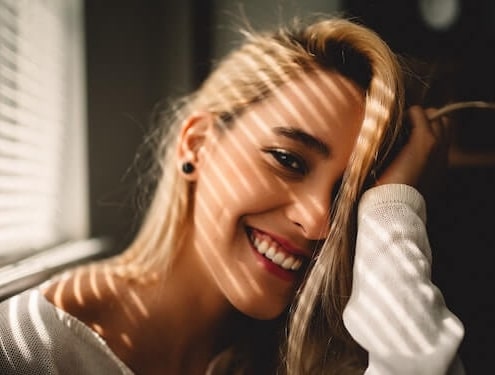 happy lady with hand on her head