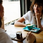 Life Coaching man and woman happily talking