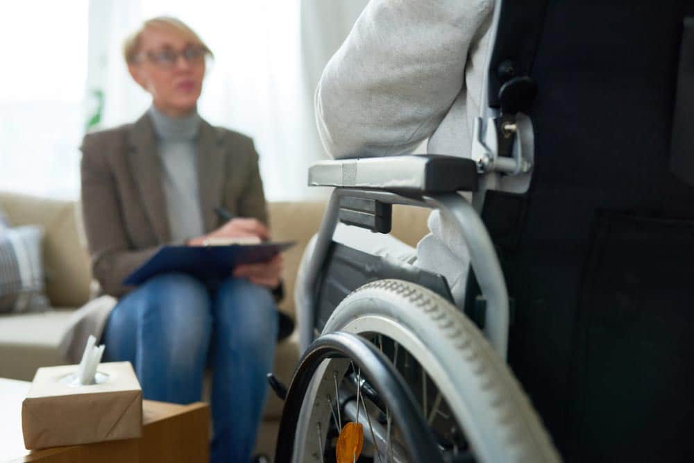 Person With A Wheelchair On A Counselling Session