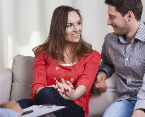 couple on couch in marriage counselling - startpoint counselling beenleigh