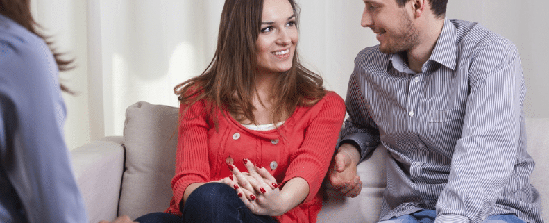 couple on couch in marriage counselling - startpoint counselling beenleigh